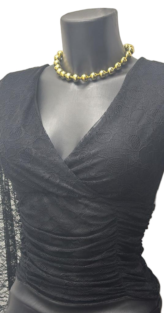 Maglia in pizzo con maniche a campana